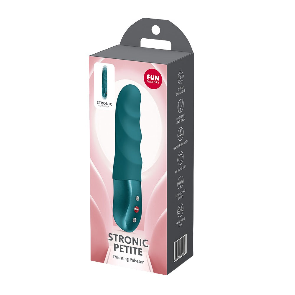 FUN FACTORY STRONIC PETITE Pulsator in Türkis neben der Originalverpackung