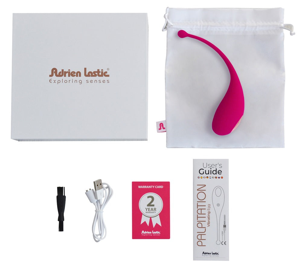 Adrien Lastic Palpitation Vibro-Ei in Pink mit Zubehör und Produktunterlagen in der Lieferumfangsansicht