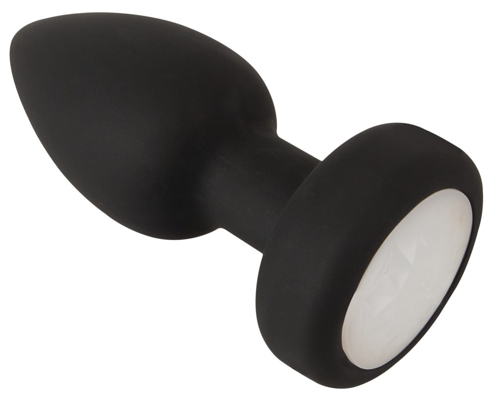 ANOS LED Analplug in Schwarz – schräge Produktansicht mit tropfenförmigem Plug und breiter LED-Basis