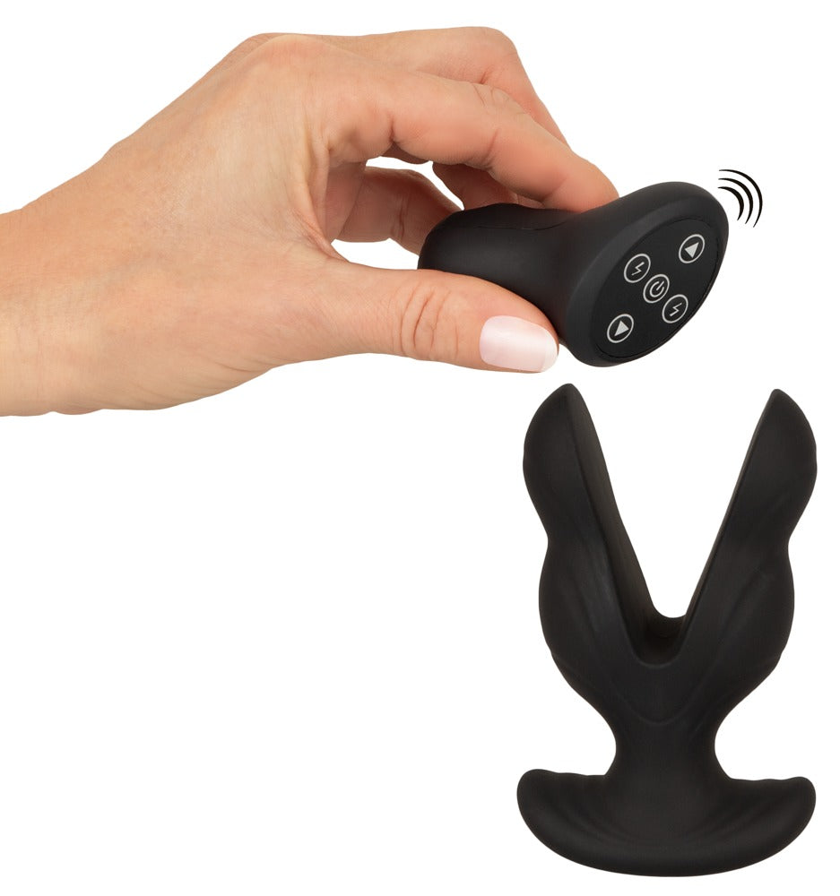 ANOS Power Expander mit E-Stim und Dual-Vibration – Größenvergleich in einer Hand mit sichtbaren Expander-Armen
