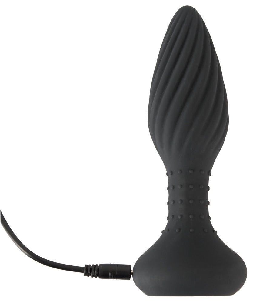 ANOS rotierender Analplug in Schwarz – aufrechte Produktansicht mit spiralförmiger Struktur, breiter Basis und angeschlossenem Ladekabel