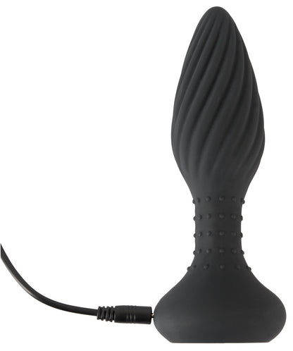 ANOS rotierender Analplug in Schwarz – aufrechte Produktansicht mit spiralförmiger Struktur, breiter Basis und angeschlossenem Ladekabel