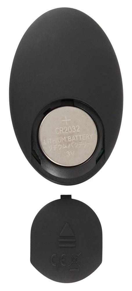 ANOS rotierender Analplug mit Vibration – Detailansicht der ovalen schwarzen Remote mit Bedienelementen