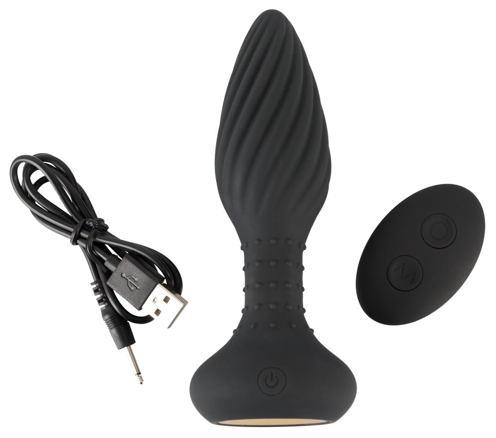 ANOS rotierender Analplug mit Vibration und Remote – Produktansicht mit Ladekabel, Remote und Zubehör