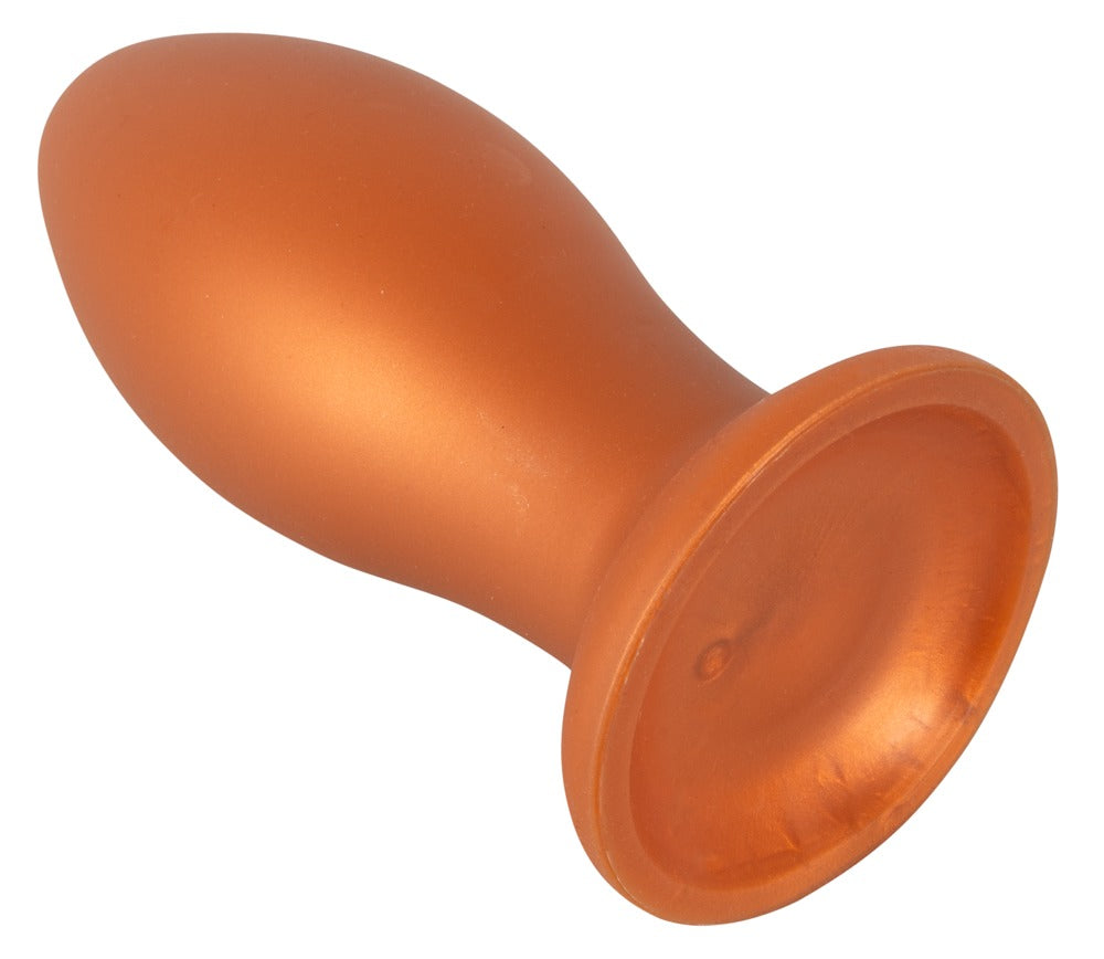 ANOS XL Analplug aus Liquid Silicone in Orange – schräge Produktansicht mit deutlich sichtbarem breitem Saugfuß