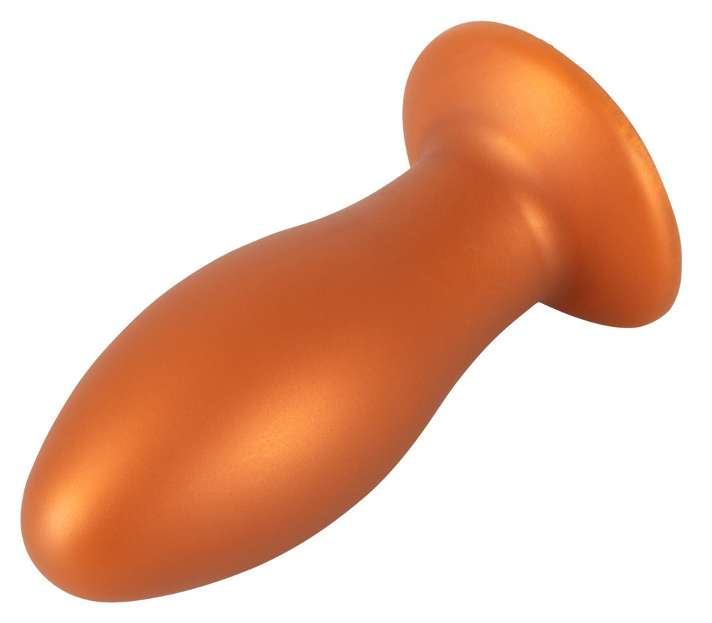 ANOS XL Analplug aus Liquid Silicone in Orange – schräge Seitenansicht mit geschwungenem Schaft und breitem Saugfuß