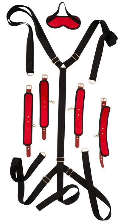 Darstellung der verstellbaren Gurte, Fesseln und Augenmaske des Bad Kitty Bettfessel-Sets Deluxe