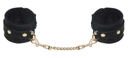 Detailansicht der Bad Kitty Handfesseln in Schwarz mit Gold-Details