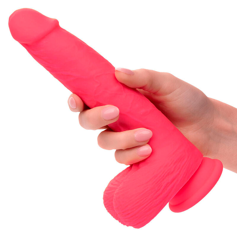 CALEXOTICS Studs Rumbling & Thrusting Vibrator in Pink bei der Handhabung