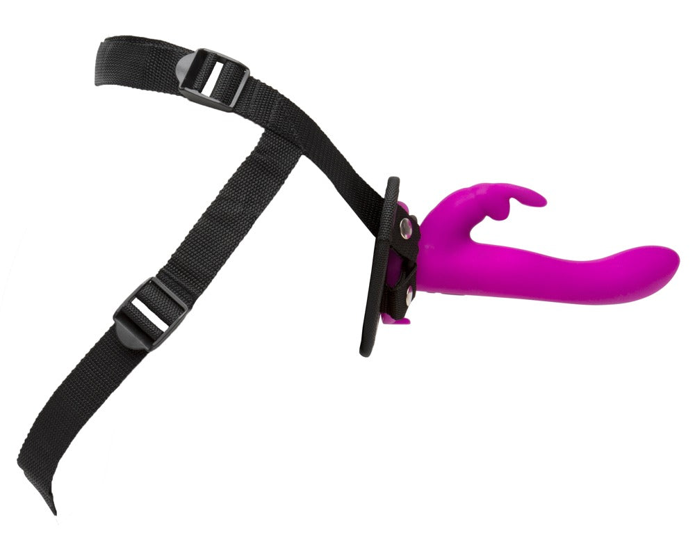 Happy Rabbit Vibrating Strap-On – schwarzer verstellbarer Strap-on-Harness mit separat dargestelltem pinkfarbenem Rabbitvibrator – erhältlich bei Evoria Care