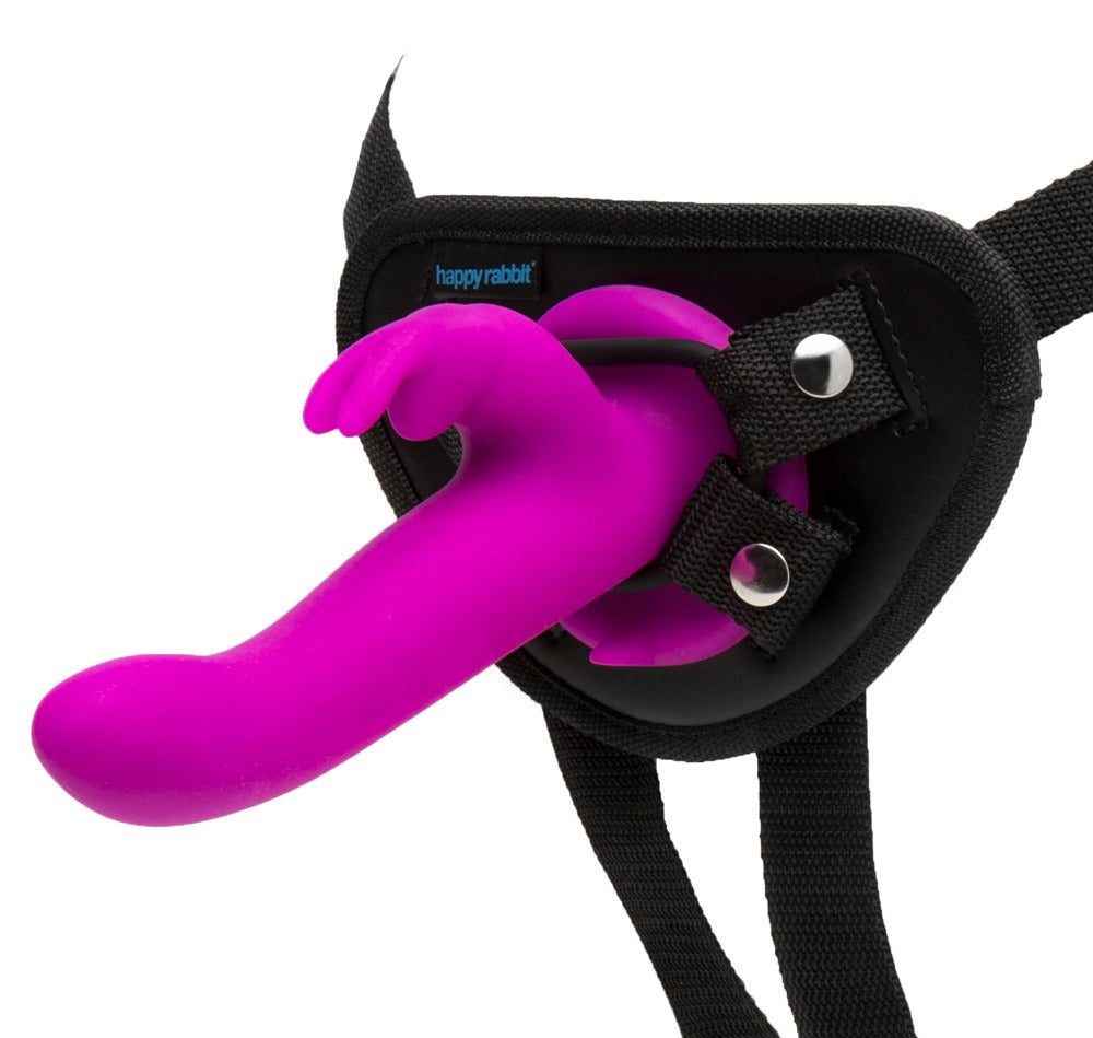 Happy Rabbit Vibrating Strap-On – Setübersicht mit schwarzem Harness und eingesetztem pinkfarbenem Rabbitvibrator – erhältlich bei Evoria Care