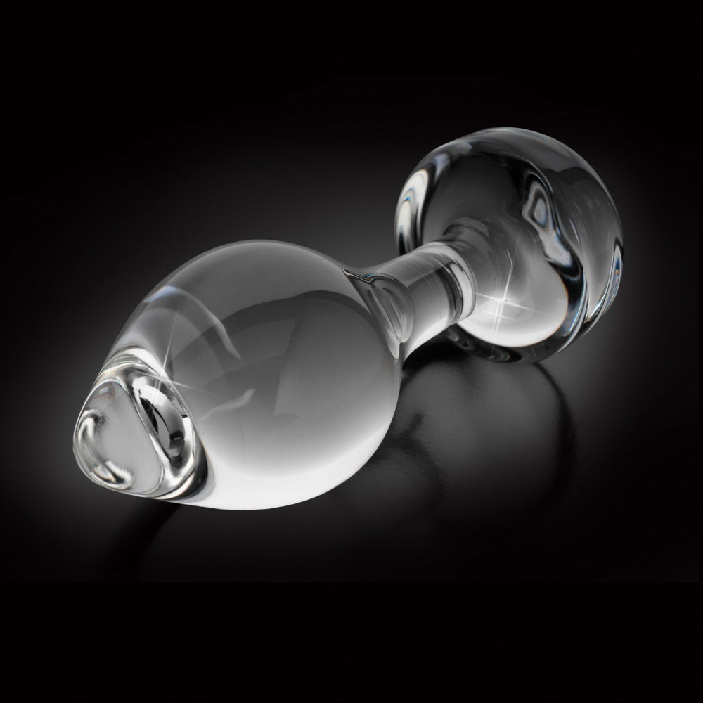 Icicles No. 44 transparenter Premium-Glasplug mit glatter Oberfläche, tropfenförmiger Spitze und kugelförmigem Standfuß in horizontaler Seitenansicht vor schwarzem Hintergrund – erhältlich bei Evoria Care