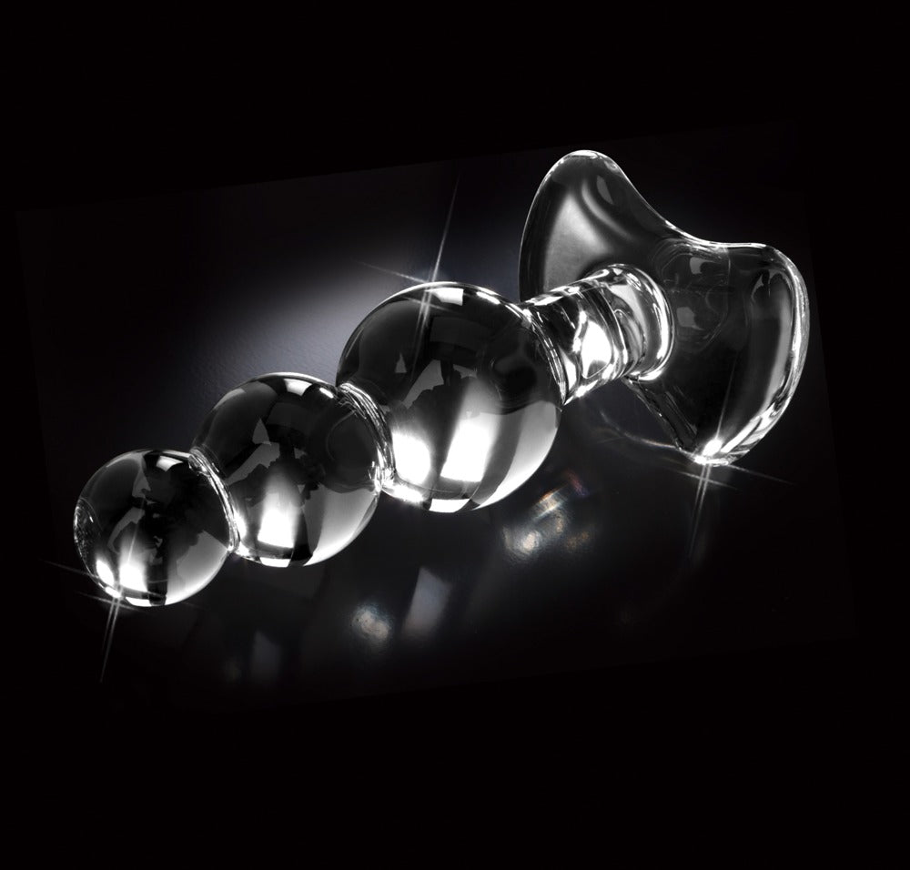 Icicles No. 47 transparenter Premium-Glasplug mit drei unterschiedlich großen Kugeln und glatter Glasoberfläche in horizontaler Seitenansicht vor schwarzem Hintergrund – erhältlich bei Evoria Care