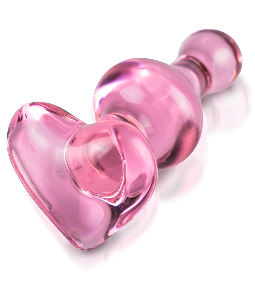 Icicles No. 75 pinkfarbener Premium-Glas-Analplug mit glänzender Oberfläche und herzförmiger Basis in schräger Detailansicht – erhältlich bei Evoria Care