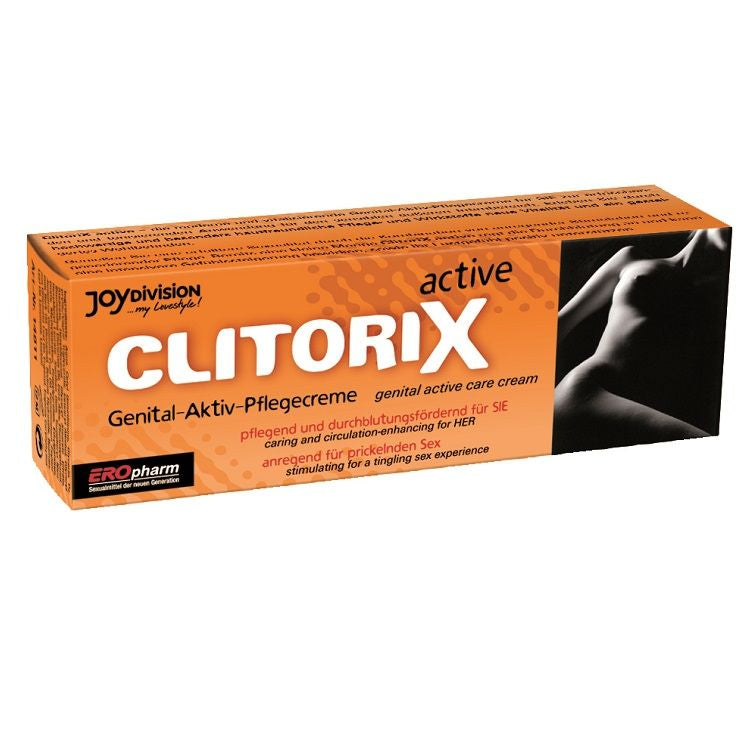 JOYDIVISION EROpharm ClitoriX – orangefarbene rechteckige Originalverpackung der Aktiv-Pflegecreme mit weißem ClitoriX Schriftzug, schwarzem Produktetikett und dekorativer Abbildung in waagerechter Vorderansicht – erhältlich bei Evoria Care