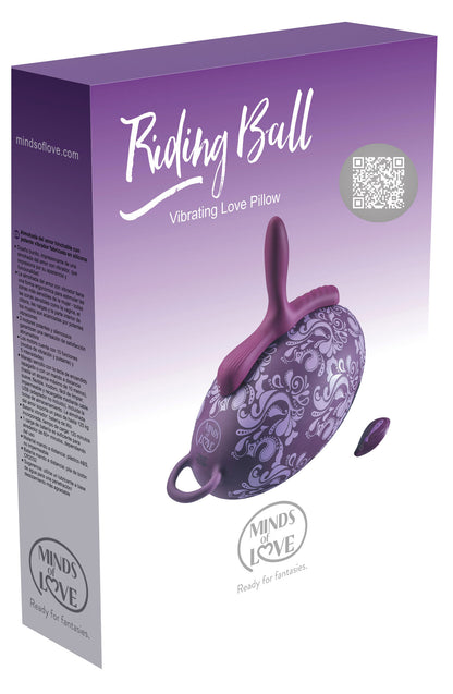 MINDS of LOVE Riding Ball Vibratorkissen mit drei Motoren in weiß-violetter Originalverpackung mit Abbildung des lilafarbenen Vibratorkissens und MINDS of LOVE Markenlogo – erhältlich bei Evoria Care