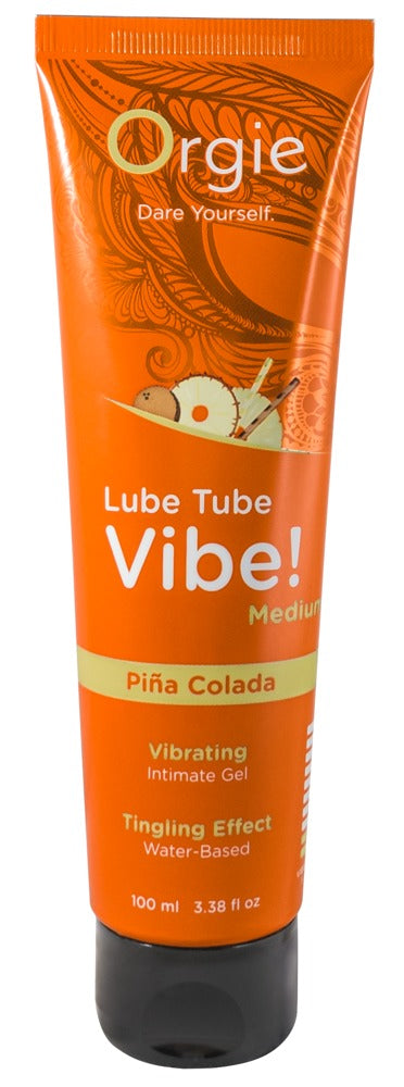 Orgie Lube Tube Vibe! Piña Colada Stimulations-Gleitgel in orangefarbener Tube mit weißem Vibe!-Schriftzug, tropischem Motiv und schwarzem Verschluss in aufrechter Frontansicht – erhältlich bei Evoria Care