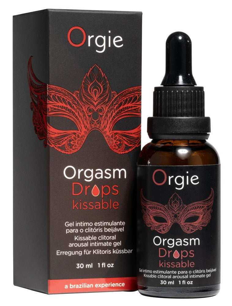 Orgie Orgasm Drops Kissable Klitoristropfen in schwarzer Pipettenflasche neben der passenden Originalverpackung mit rotem Lippenmotiv und Orgie Markenlogo – erhältlich bei Evoria Care