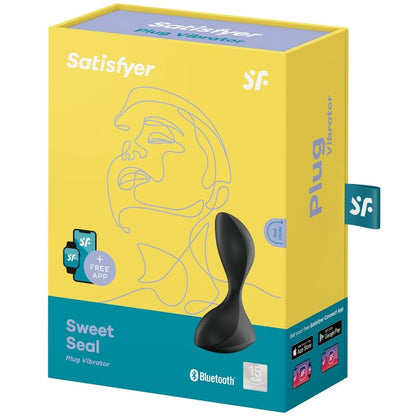 Satisfyer Sweet Seal – gelb-türkise Originalverpackung des schwarzen Analplugs mit Produktabbildung, Satisfyer Markenlogo und aufgedruckten Produktinformationen in schräger Verpackungsansicht auf weißem Hintergrund – erhältlich bei Evoria Care