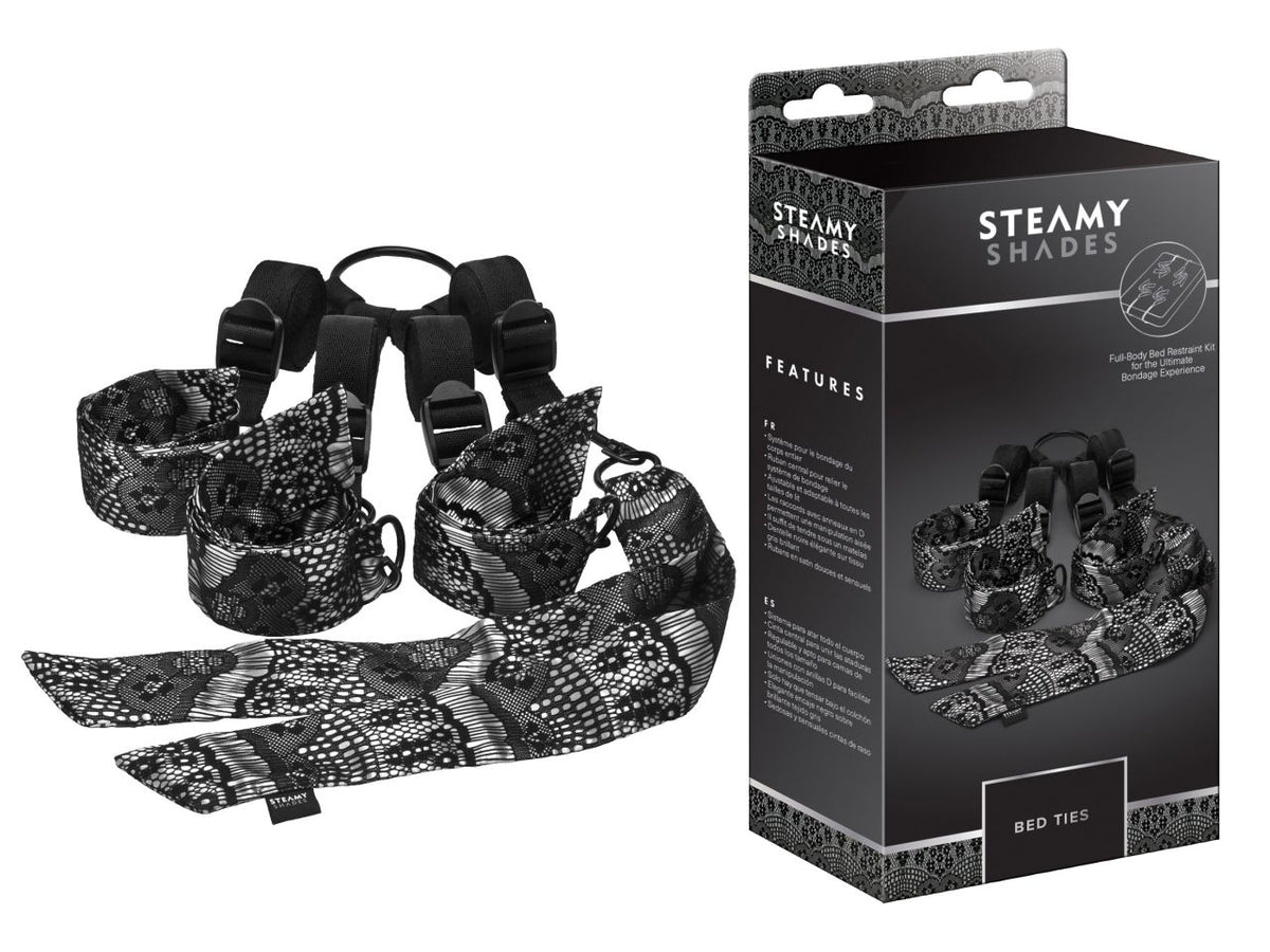 STEAMY SHADES Bed Ties verstellbares Unterbett-Fesselsystem in Schwarz mit gepolsterten Manschetten, verstellbaren Gurten und silberfarbenen Verbindungselementen, dargestellt neben der schwarzen Originalverpackung – erhältlich bei Evoria Care