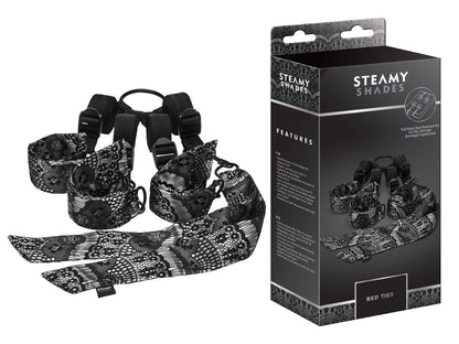 STEAMY SHADES Bed Ties verstellbares Unterbett-Fesselsystem in Schwarz mit gepolsterten Manschetten, verstellbaren Gurten und silberfarbenen Verbindungselementen, dargestellt neben der schwarzen Originalverpackung – erhältlich bei Evoria Care
