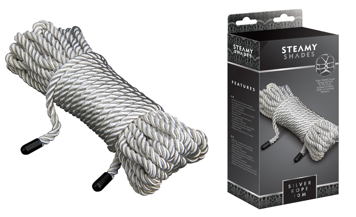 STEAMY SHADES Silver Rope Shibari-Fesselseil in Silber mit geflochtener Seilstruktur und schwarzen Endstücken, zu einem kompakten Bündel gelegt und neben der schwarzen Originalverpackung dargestellt – erhältlich bei Evoria Care
