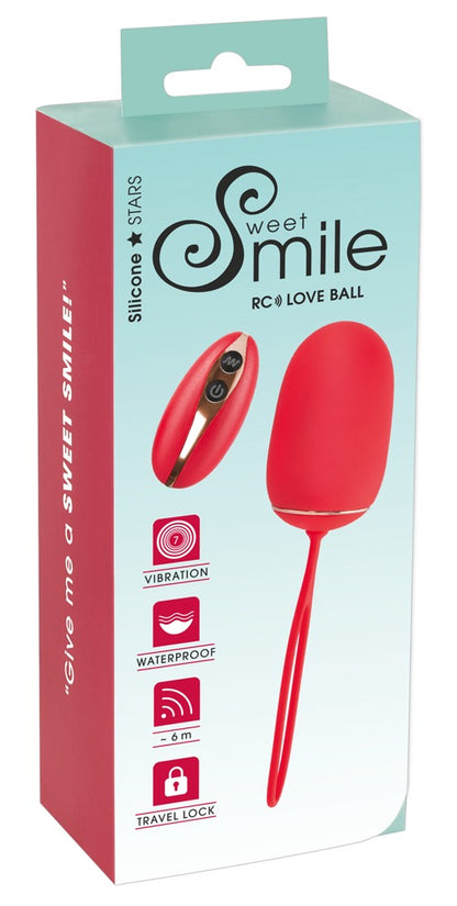 Sweet Smile RC Love Ball – rote Vibrokugel mit Fernbedienung zusammen mit der Sweet Smile Verpackung – erhältlich bei Evoria Care