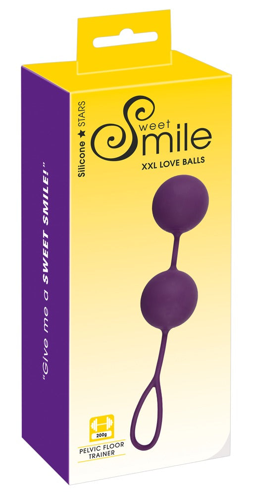 Sweet Smile XXL Balls in Dunkelviolett – Liebeskugeln für Beckenbodentraining zusammen mit der gelben Sweet Smile Verpackung – erhältlich bei Evoria Care