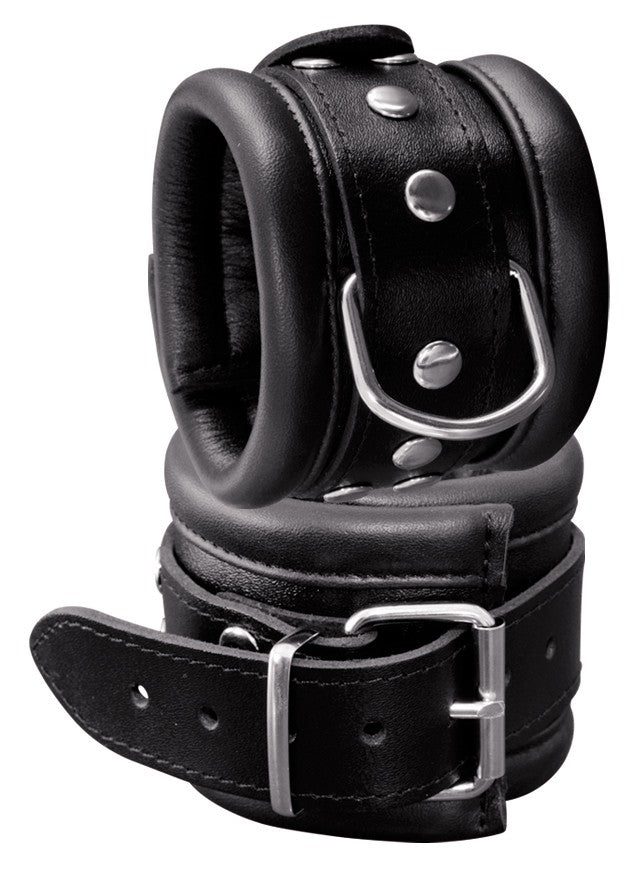 XX-DREAMSTOYS Leder-Handfessel breit – schwarze breit gepolsterte Handfesseln aus Rindsleder mit Schnallenverschlüssen und Metallösen in einzelner Produktansicht – erhältlich bei Evoria Care