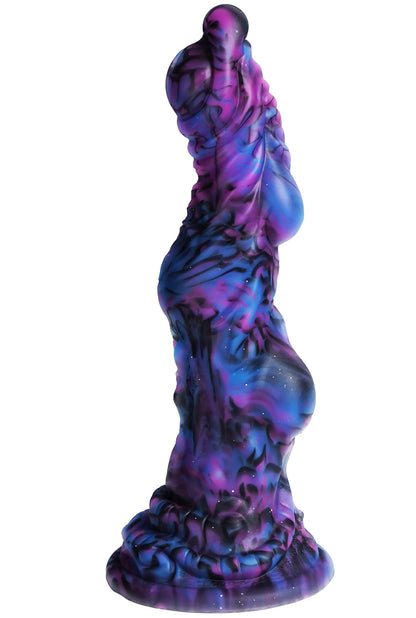 XX-DREAMSTOYS Mutant Dildo No. 14 – seitliche Ansicht des mehrfarbigen Fantasy-Dildos mit geschwungenem Schaft, markanten organischen Wellenstrukturen und breiter Basis in kräftigen Violett-, Blau- und Pinktönen – erhältlich bei Evoria Care