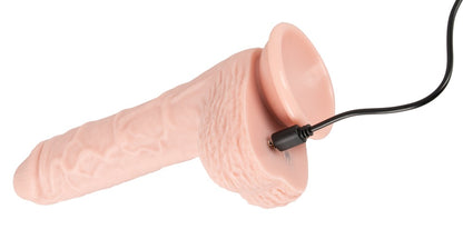 You2Toys Medical Silicone RC Thrusting Vibrator in Hautfarbe – Produktansicht mit angeschlossenem Ladekabel – erhältlich bei Evoria Care