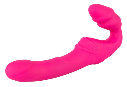 You2Toys Vibrating Strapless Strap-On in Pink – liegende Seitenansicht mit geschwungenem Hauptschaft und abgerundetem körpernahem Bereich – erhältlich bei Evoria Care