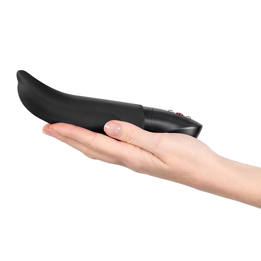FUN FACTORY DIVA DOLPHIN Vibrator in Schwarz auf einer Hand zur Veranschaulichung der Produktgröße