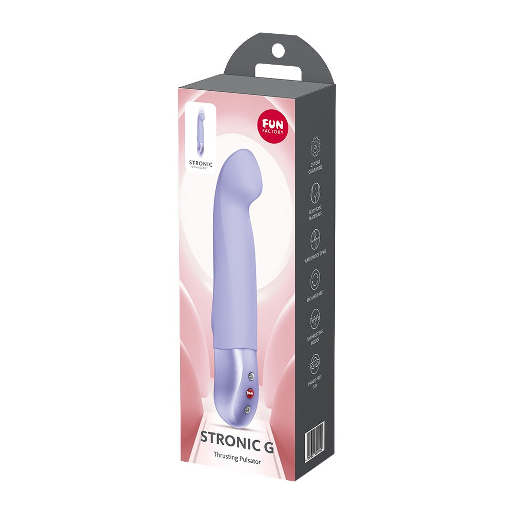FUN FACTORY STRONIC G Premium-Pulsator in Lila neben der Originalverpackung