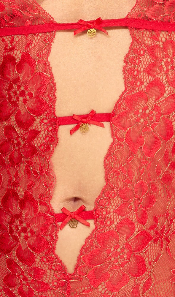 Detailansicht des kissable Straps-Bodys aus roter Spitze mit goldfarbenen Reflexen, Schleifchen und Glitzersteinen