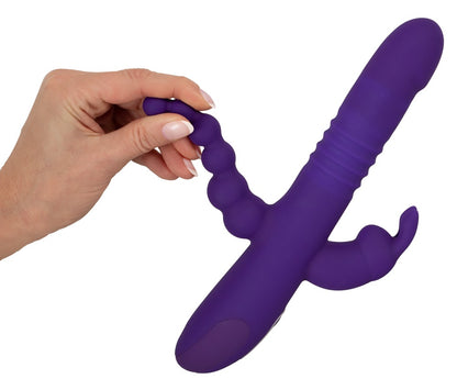 Sweet Smile Thrusting Pearl Triple in Lila – Produktansicht in der Hand zur Darstellung der flexiblen seitlichen Stimulationsbereiche