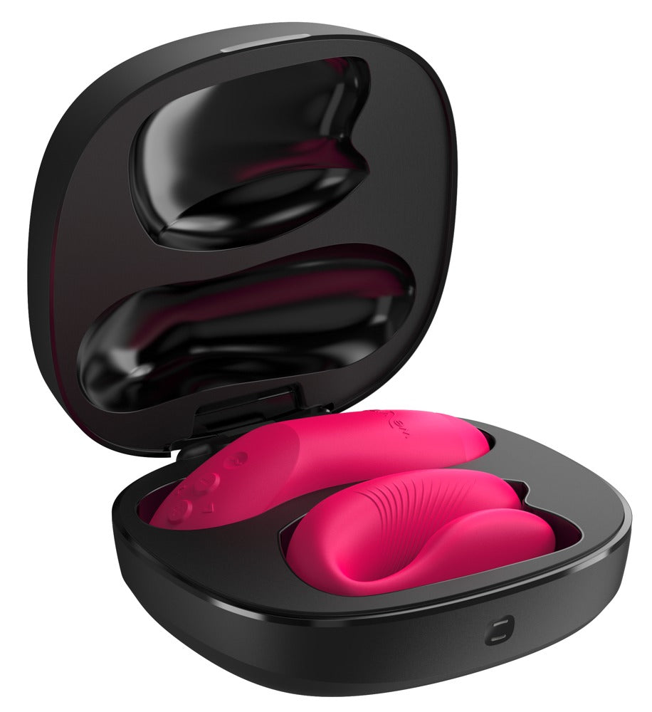 Geöffnetes Aufbewahrungs- und Ladeetui des We-Vibe Chorus Pro mit Paarvibrator in Pink
