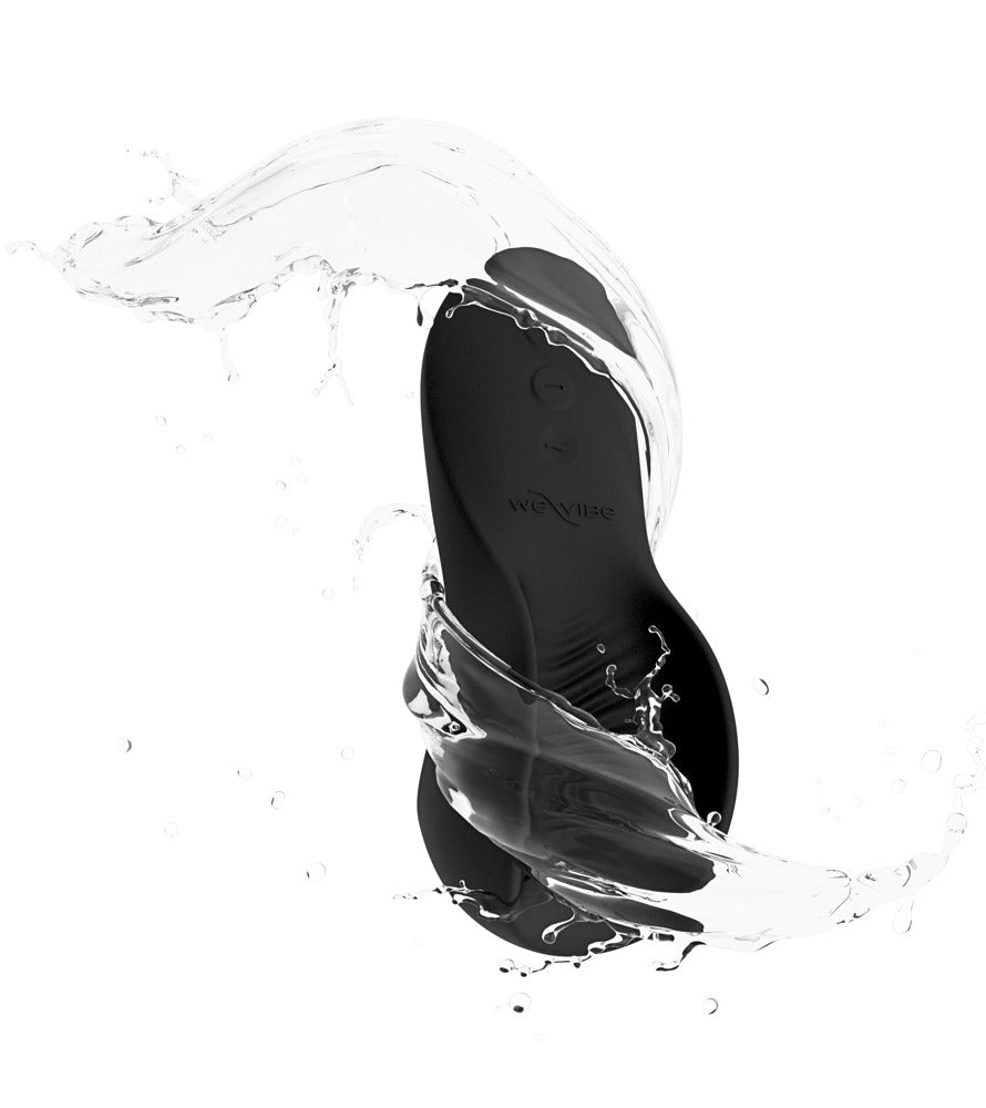 We-Vibe Shared Touch in Schwarz mit Wasserspritzern zur Darstellung der IPX7-Wasserdichtigkeit