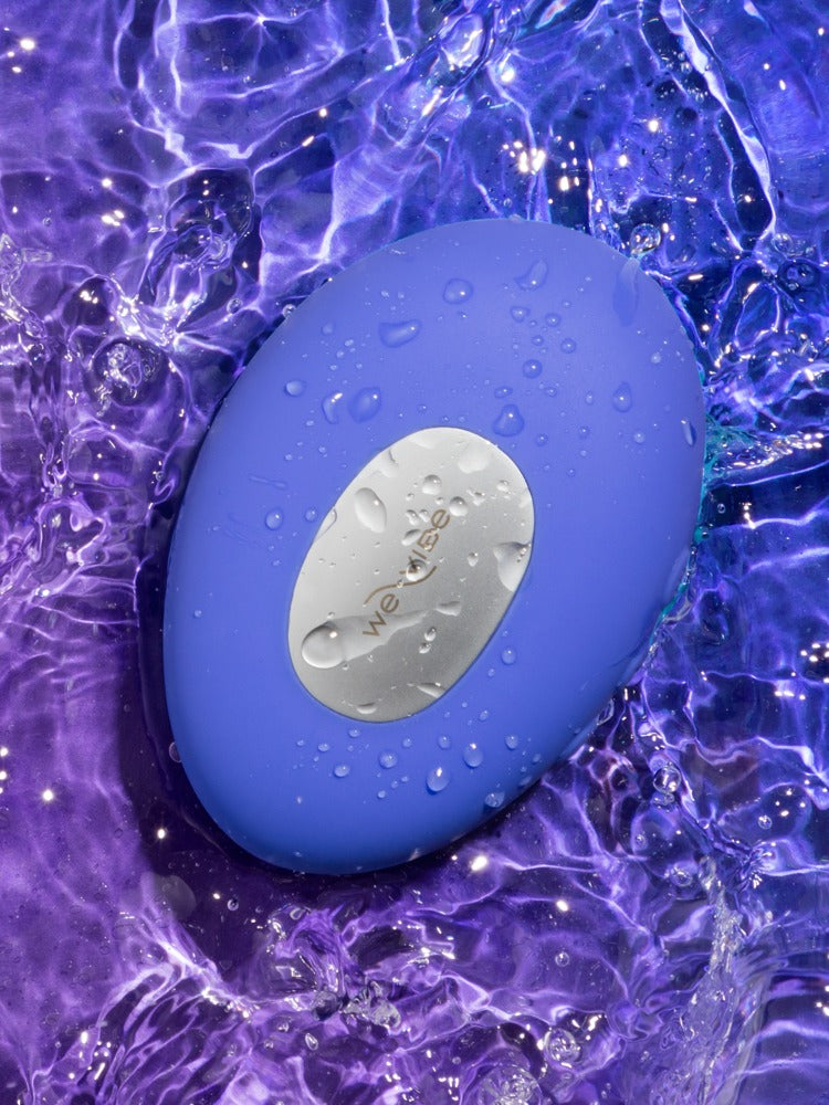 We-Vibe Temp Auflegevibrator in Blau auf leuchtendem Hintergrund