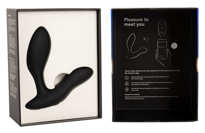 Geöffnete Verpackung des schwarzen We-Vibe Vector+ mit Zubehör