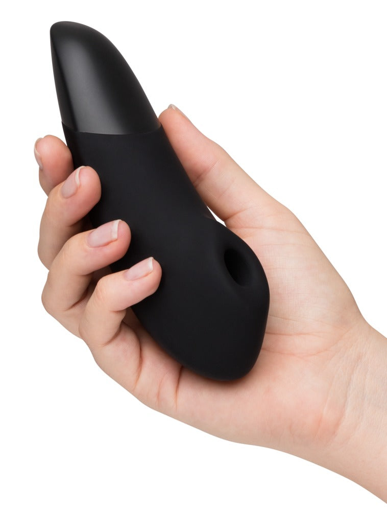 Womanizer Enhance Druckwellenvibrator ergonomische Handbedienung