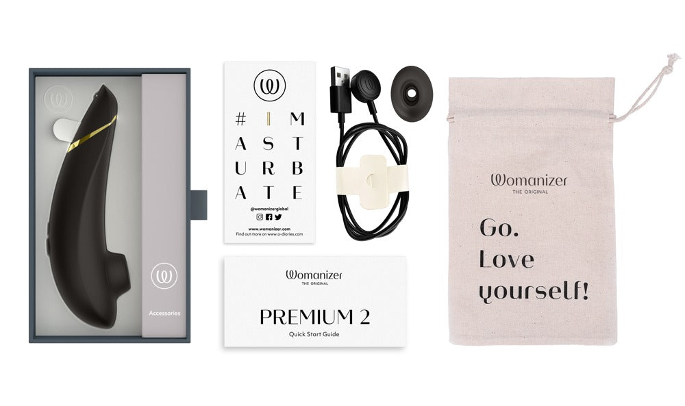 Womanizer Premium 2 Lieferumfang mit Ladegerät und Aufsatz